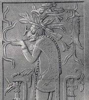 Бог, курящий сигару. Рельеф из святилища в Храме креста. Рис. Ф. Вальдека.